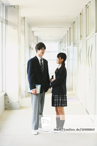 Japanese high-school students in school corridor