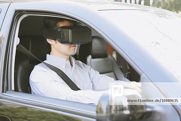 Japanese man using virtual reality device in the car