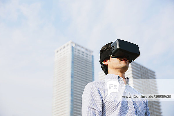 Japanese man using virtual reality device