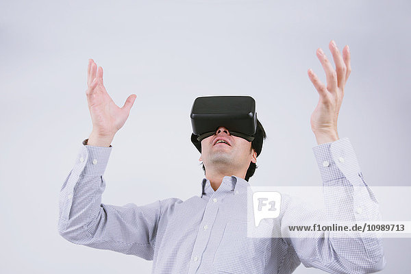 Japanese man using virtual reality device