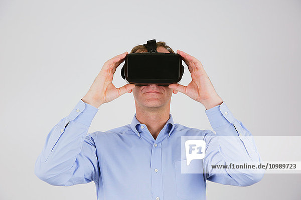 Caucasian man using virtual reality device