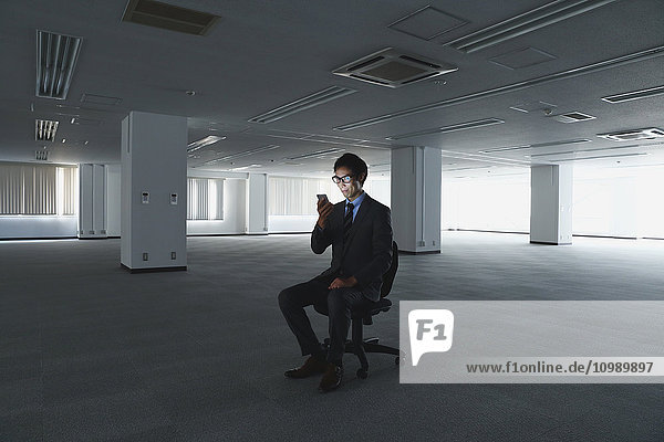 Japanese businessman in empty office