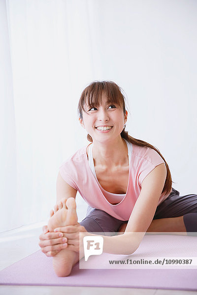 Young Japanese woman practicing yoga