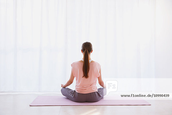 Young Japanese woman practicing yoga