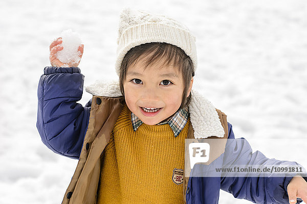 Kid playing in the snow