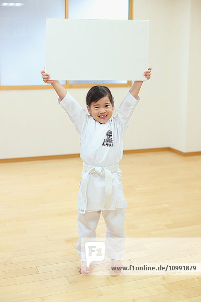 Japanese kid in karate uniform training