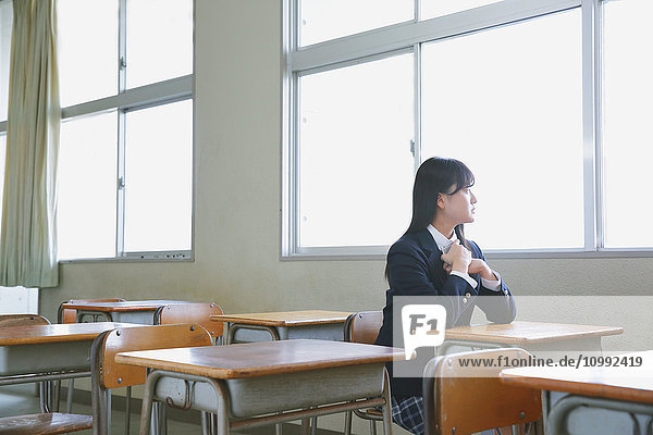 Japanese high-school student in empty classroom