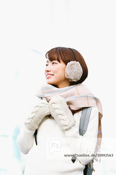 Attractive Japanese woman with muffler on a Winter sunny day