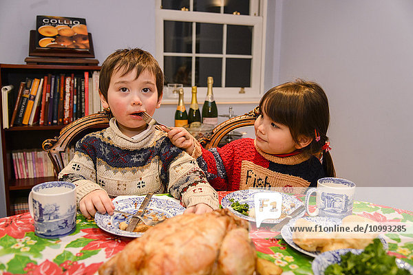 Kids eating in the house at Christmas