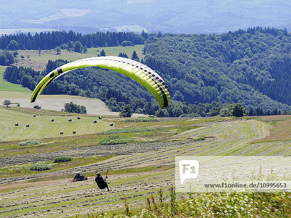 Paraglider  Wasserkuppe  Rhoen Biosphere Reserve  Southern Germany  Germany  Europe