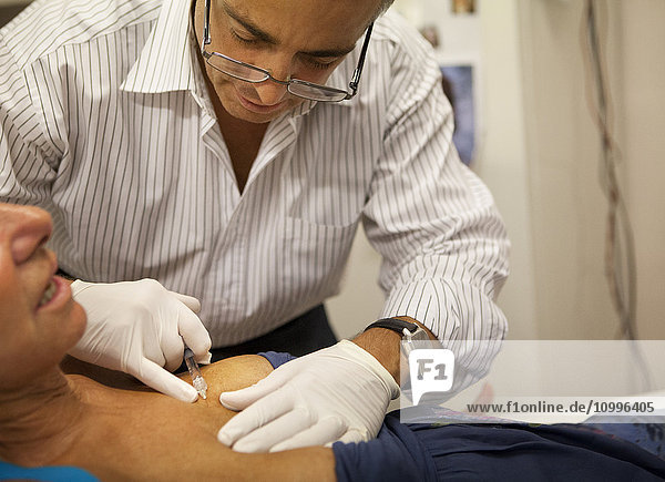 Reportage on a GP who uses mesotherapy in Geneva  Switzerland. Mesotherapy is a medical treatment which consists of administering medicine through micro-injections in the skin. Here the doctor injects a patient with hyaluronic acid.