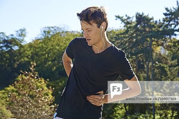 Jogger suffering from a side stitch.