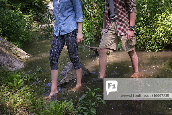 Couple wading in water