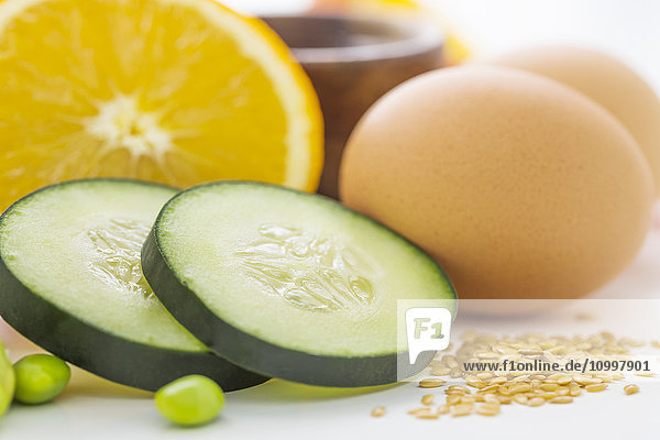 Eggs with slices of cucumber and orange