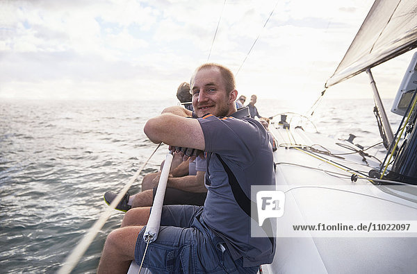 Portrait smiling man sailing on sailboat