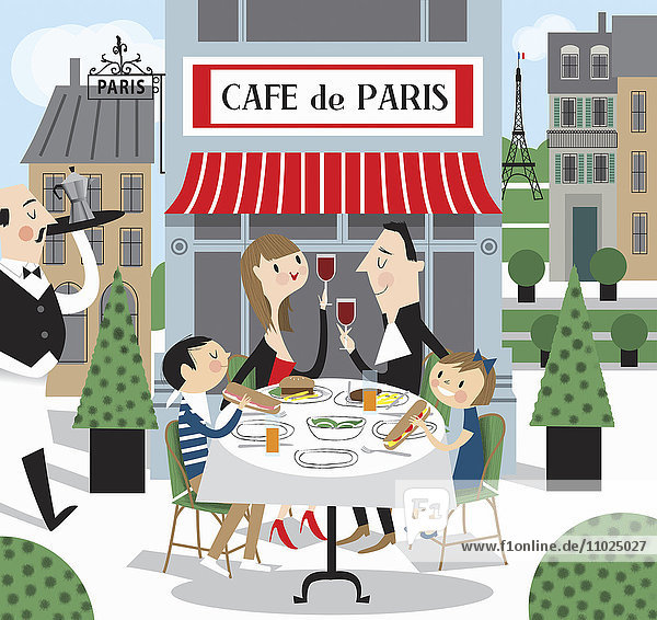 Familie isst zusammen in einem Straßenrestaurant in Paris  Frankreich