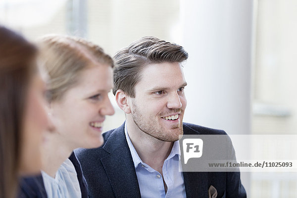 Happy business people in meeting at office