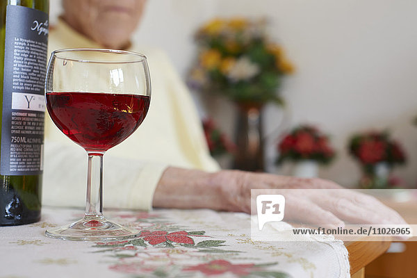 Wine bottle and glass in nursing home