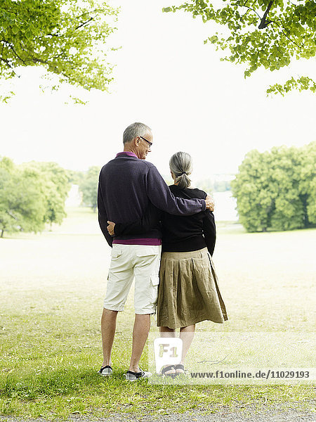 Senior couple standing in park