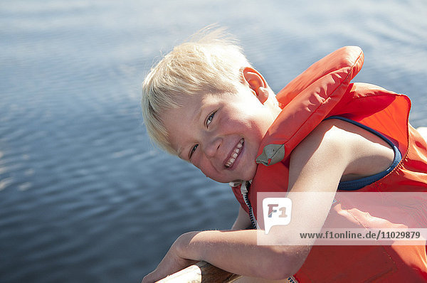 Smiling boy on boat