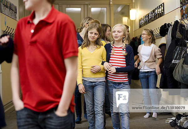 Children walking in corridor during break
