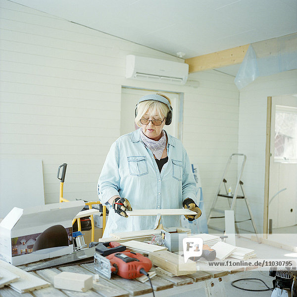 Senior woman doing carpentry