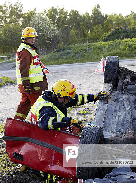 Firefighters rescue people from crashed car