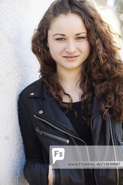 Portrait of teenage girl wearing leather jacket