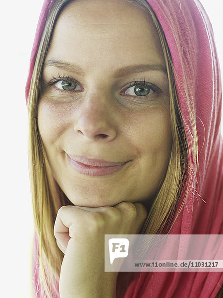 Young woman wearing pink shawl