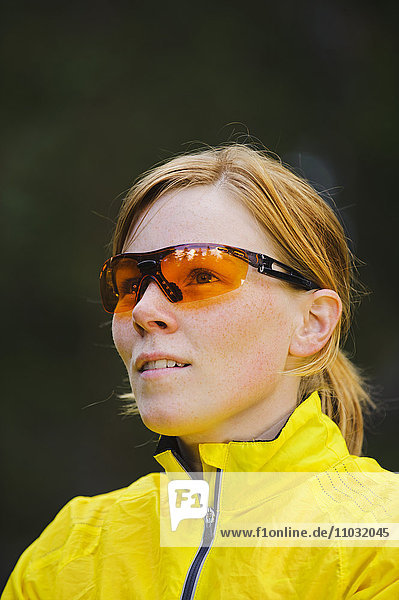 Female jogger wearing sunglasses