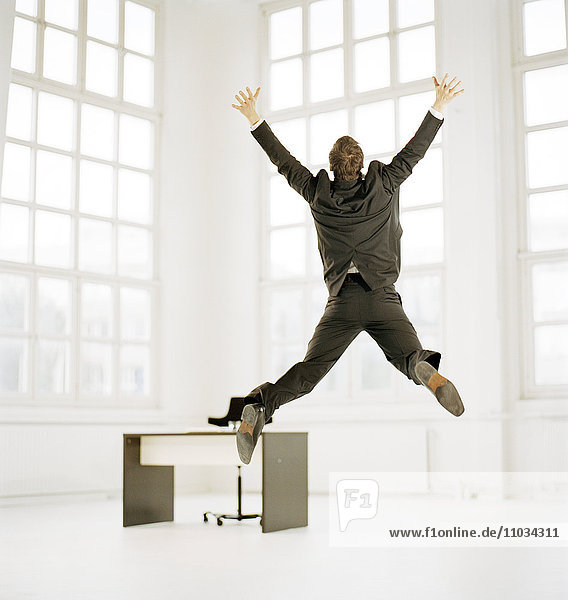 A man jumping in happiness.