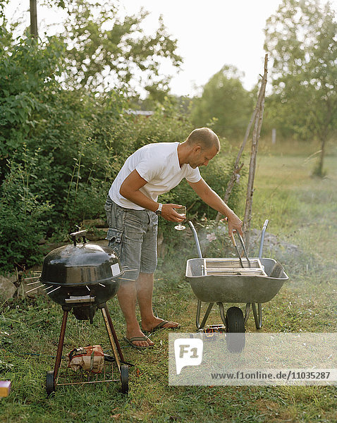 A man with an outdoor grill.