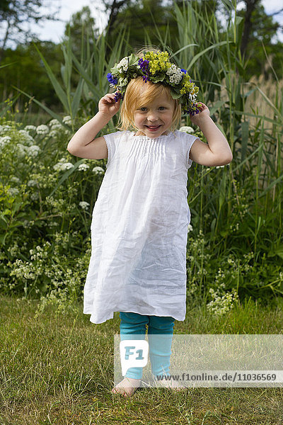 A little girl celebrating midsummer  Sweden.