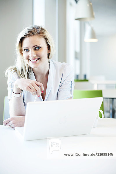 Blond woman using a laptop Sweden.