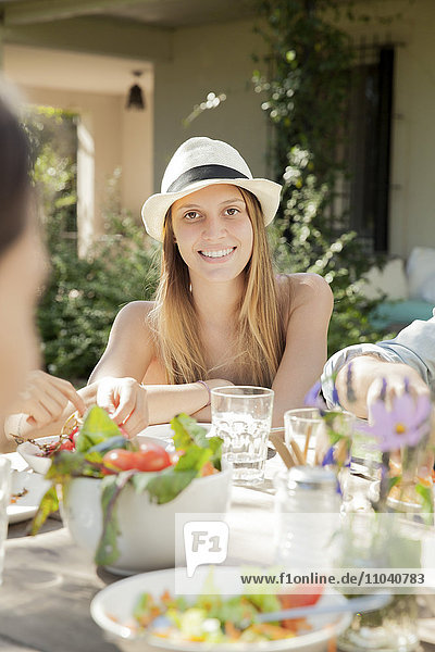 Woman enjoying healthy meal with friends
