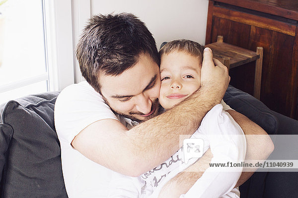 Father hugging child  portrait