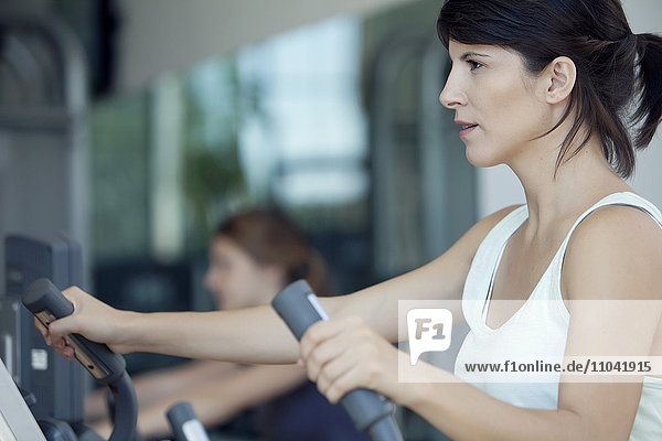 Woman exercising in fitness club