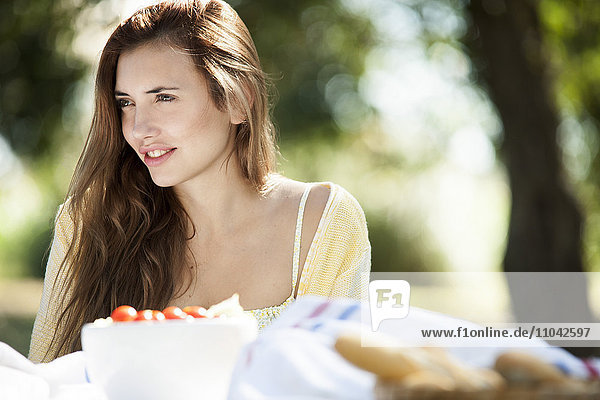 Woman enjoying meal outdoors