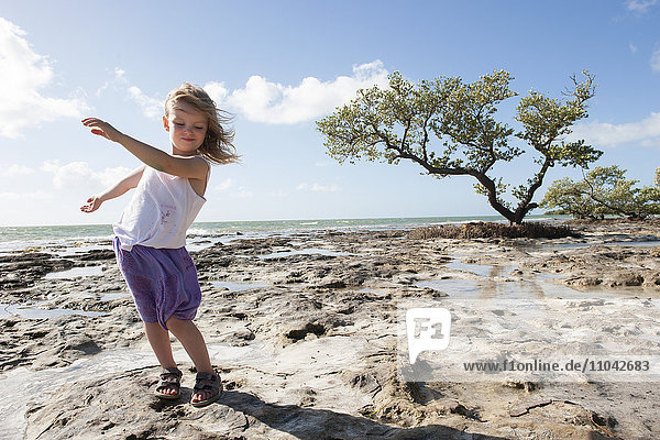 Girl dancing on beach in the Florida Keys  Florida  USA