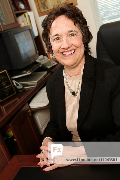 Businesswoman smiling at desk