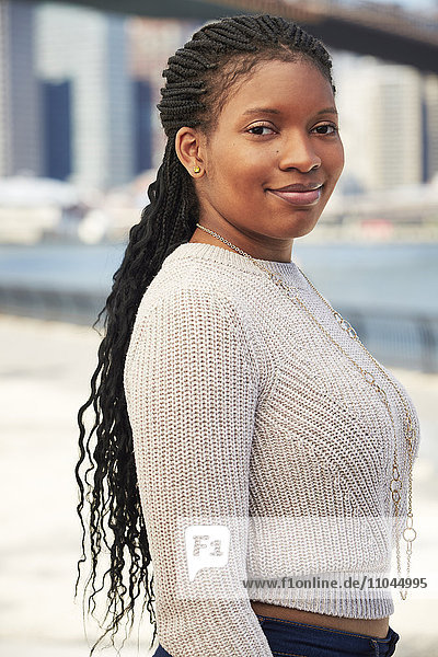 Black woman posing at waterfront