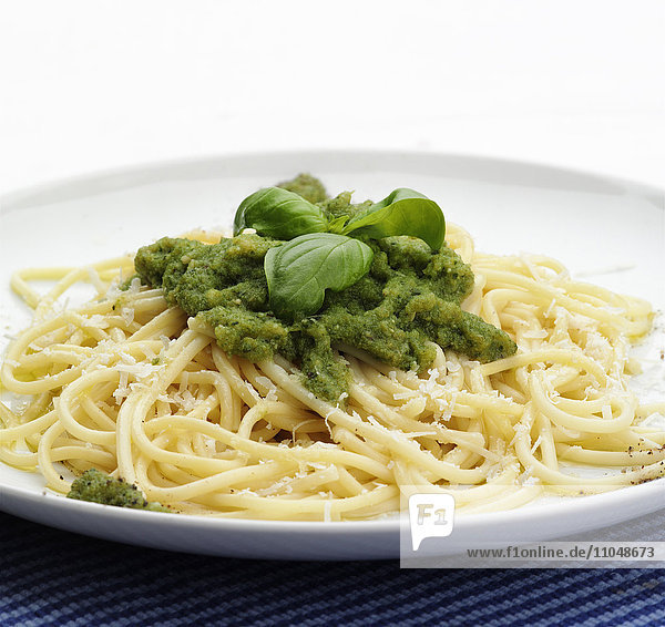 Close up of plate of pesto pasta