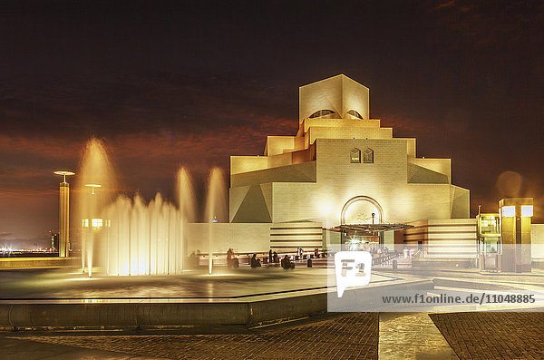 Doha Museum of Islamic Art illuminated at night  Doha  Qatar