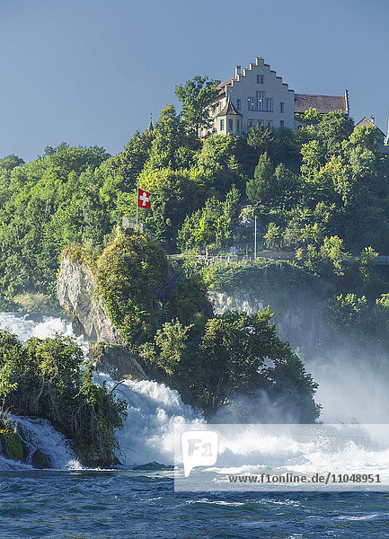 House on cliff overlooking river