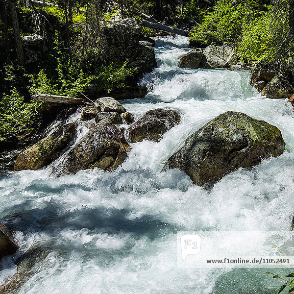 River rapids flowing at rocks