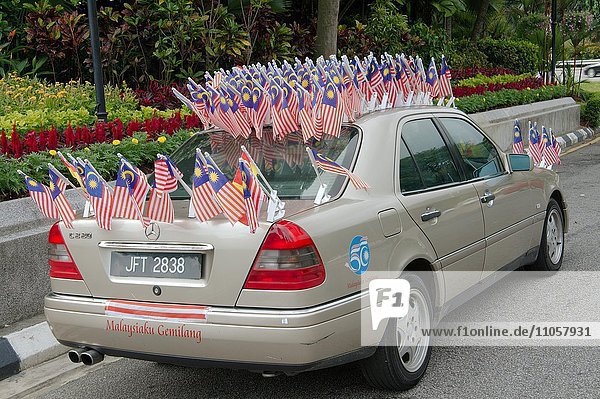 Car decorated with national flags of Malaysia  Hari Merdeka Independence Day  Kuala Lumpur  Malaysia  Asia