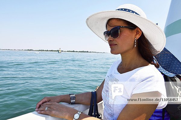 Woman on a ferry  water taxi  boat  Venice  Veneto  Italy  Europe