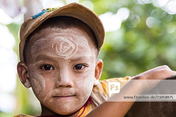 Child with Thanaka paste in the face of mountain tribe or mountain people Pa-O or Pa-Oh or Pao or Black Karen or Taungthu or dew-soo ethnic minority portrait near Kalaw Shan State Myanmar Myanmar Asia