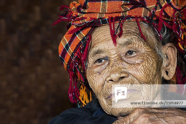 Old woman of mountain tribe or mountain people Pa-O or Pa-Oh or Pao or Black Karen or Taungthu or dew-soo ethnic minority portrait near Kalaw Shan State Myanmar Asia