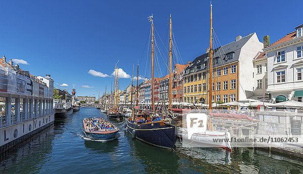 People in tourist boat in Nyhavn Canal  Nyhavn  Copenhagen  Denmark  Europe